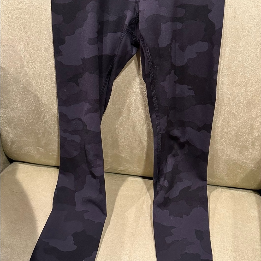 Lululemon leggings. Black camo print. 25 inches long. Size 0. Barely worn.